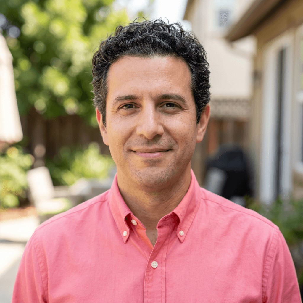 Alan Reyes, a male fix and flip investor, looking confident
